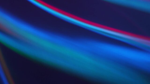 Abstract Neon Light Refractions: Real 4K Camera Footage of Vibrant Flowing Wave Patterns