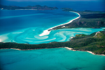 Queensland ocean and Whitsunday Islands captured from above with aerial view of islands and coastline