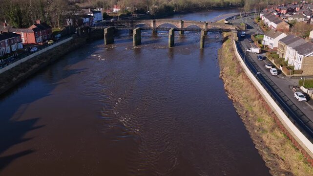 Aerial video of River Ribble flood defenses and Broadgate in Preston, Lancashire. 