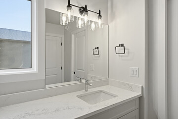Bathroom with a white sink and a mirror