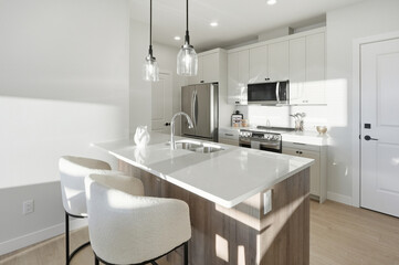 Kitchen with a white countertop and a wooden island