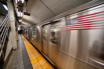 Fototapeta premium Subway train arriving at station in New York City underground transportation system