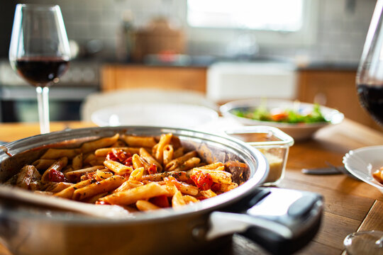 Homemade penne pasta dinner in a cozy home kitchen