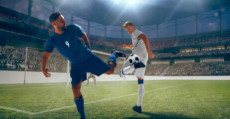 Soccer players play football at the stadium. © Artur Didyk
