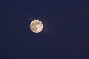 Lunar Craters Visible on the Moon. Moon Close-Up in the Night Sky. Full Moon in a Clear Night Sky. Detailed Moon Surface Against Dark Sky. © onderortel