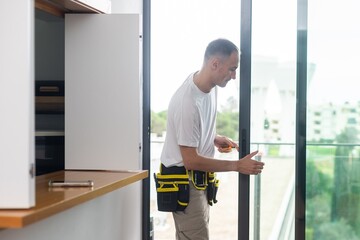 man installing aluminum frame sliding terrace doors