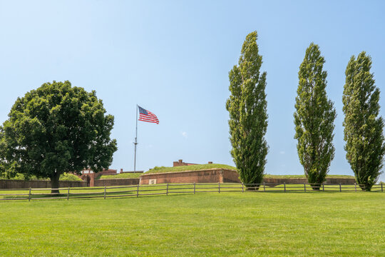 Baltimore, Maryland, US - July 26, 2023: The American flag flies over Ft McHenry historic site in Baltimore's Harbor