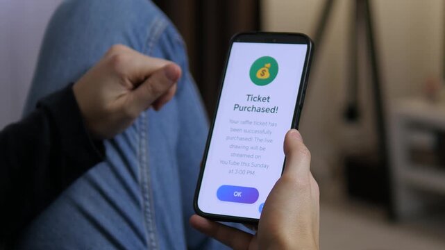 Modern lifestyle shot of a user participating in an online cash prize draw. Cinematic close-up of a smartphone with a successful raffle entry notification. Ideal for content about digital luck
