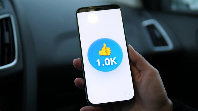 Viral growth concept: smartphone screen showing likes skyrocketing from hundreds to thousands. Perfect for social media marketing, influencer success, and digital engagement stories. High-quality