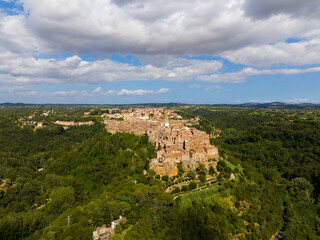 Fototapeta premium Aerial view of Pitigliano hill town under blue sky, Tuscany, Italy