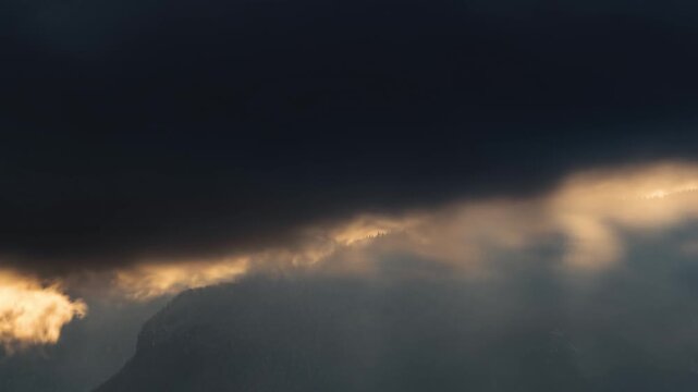Time Lapse of Dramatic Clouds Moving Fast Over Mystic Alpine Forest Mountains