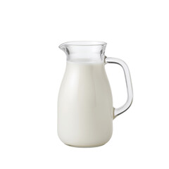 Milk is Poured Into a Glass Jug on a White Background for Serving or Cooking