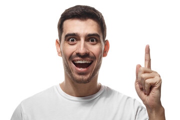 Fototapeta premium Man expressing joy and idea pointing up with finger showing excited facial expression