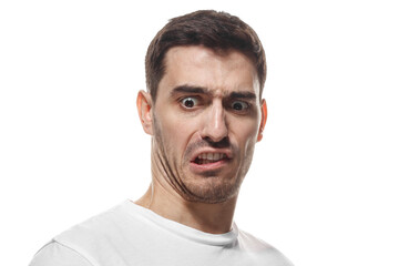Fototapeta premium Angry man showing teeth with intense disgusted expression and negative emotion