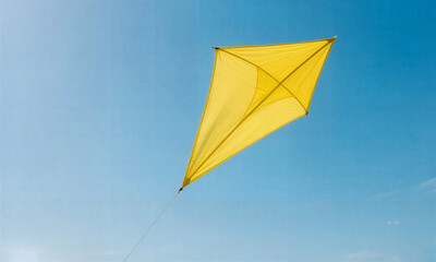 Bright yellow kite soars against clear blue sky alone.