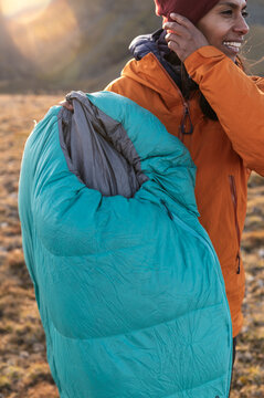 Peaceful female finding emotional balance after hiking outdoors