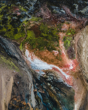 Aerial view of the rugged, mineral-rich landscape shows off nature's abstract artistry with colorful striations, Landmannalaugar, Rangarthing ytra, Iceland.