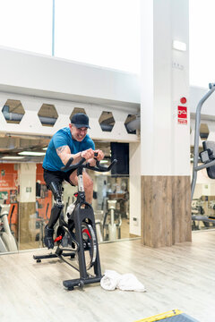 Man with prosthetic leg training on exercise bike