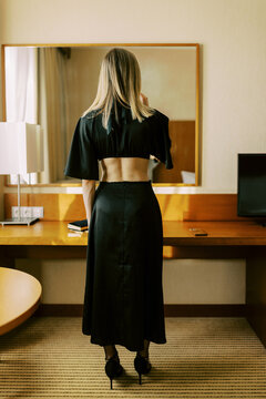 Woman with electronic cigarette in Hotel Room Before Event