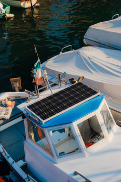 Yacht with solar panel on the roof on Como lake 