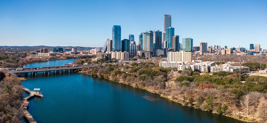 Obraz premium Aerial panoramic view along Lady Bird Lake towards downtown Austin Texas from the east with hike and bike trail