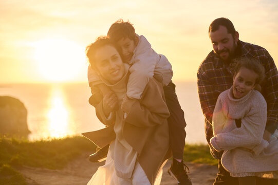 happy cheerful smiling family in nature