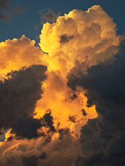 Fototapeta premium Dramatic dark storm clouds at sunset, a symbol of climate change and environmental crisis