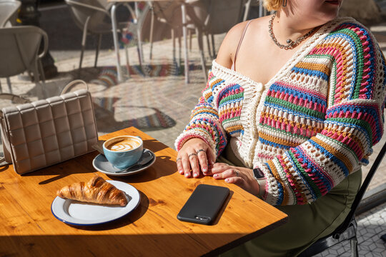 Plus size woman at cafe 