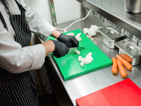 Chef Preparing Vegetables in a Professional Kitchen