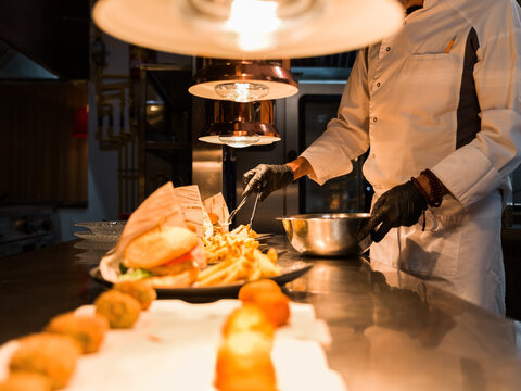 Chef plating gourmet burgers 