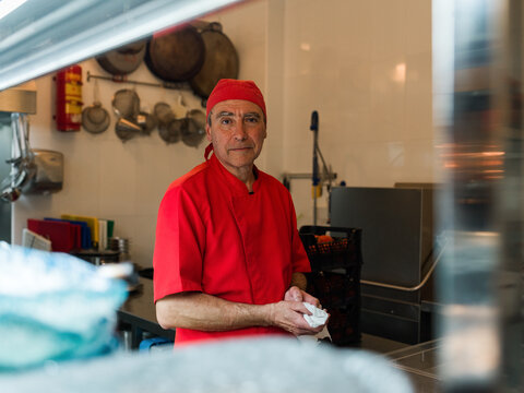 Portrait of senior kitchen porter 