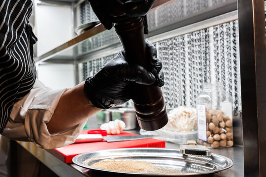 Cook preparing spices 