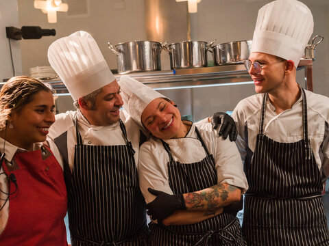 Chefs Celebrate Together in a Kitchen Setting