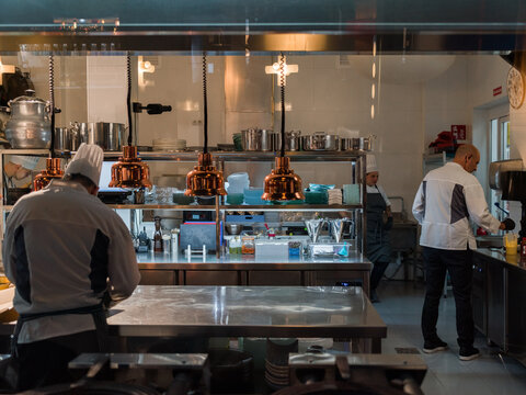 Busy Kitchen With Chefs Preparing Meals During the Evening Shift