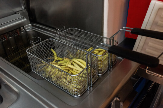 Cooking Freshly Cut Fries in a Commercial Deep Fryer Setup