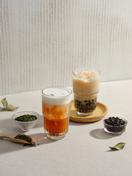 Two glasses of bubble tea in a still-life setup