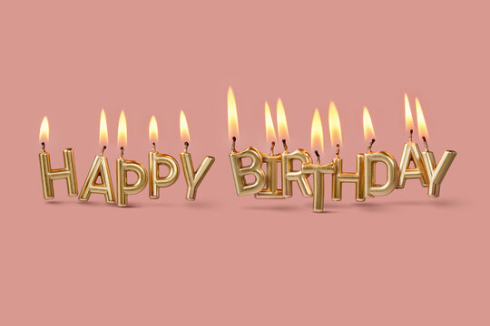 Happy birthday candle letters on pink background