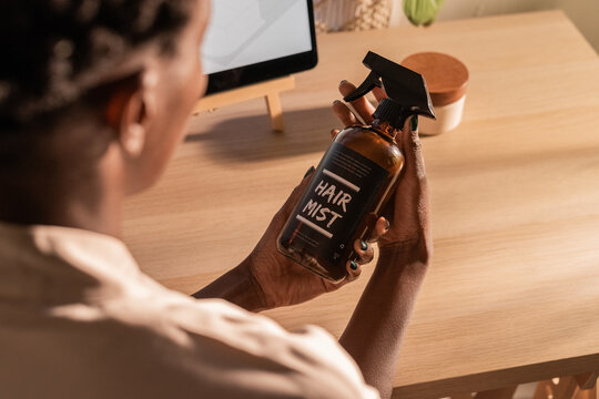Woman holding beauty product 