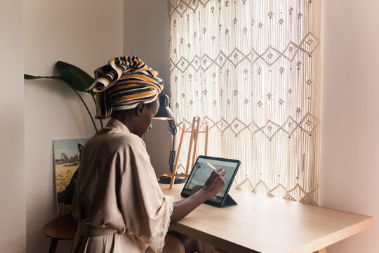 Woman Creating Digital Art on Tablet Computer 