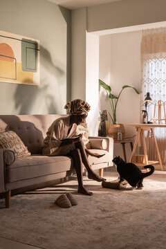 Woman feeding her cat 