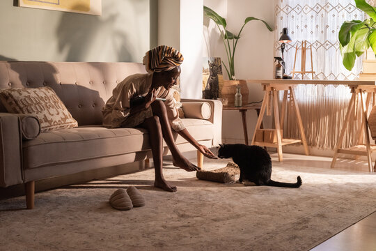 Woman Bonding With a Cat at Home