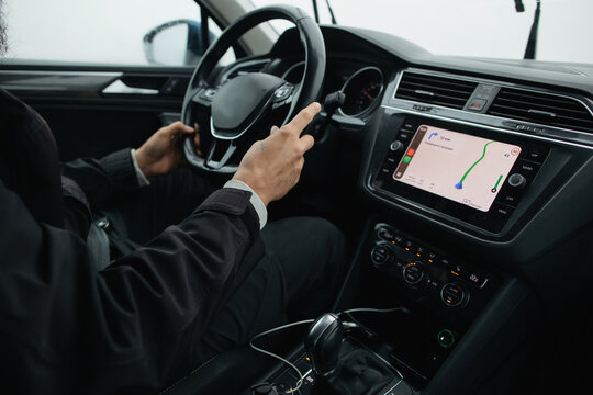 Anonymous man uses car navigation system