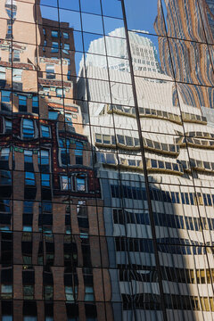 Distorted Building Reflections on Glass Facade