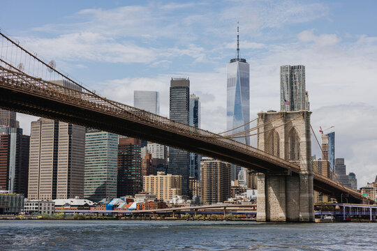 Brooklyn Bridge Spans Over the East River With City Skyline Backdrop