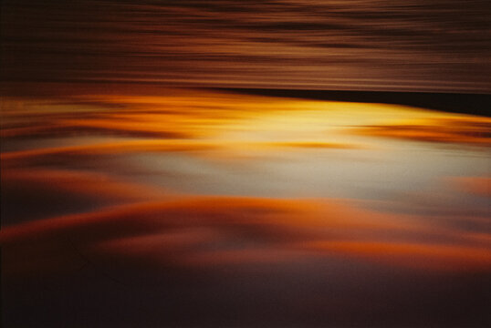 Blurry abstract photo of the beach at sunset