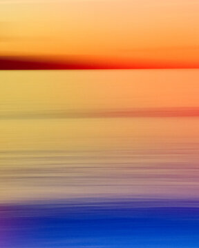 Blurry abstract photo of the beach at sunset