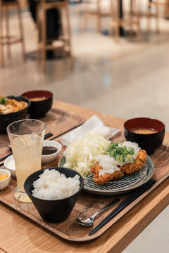 Deep-Fried Pork Cutlet Served With Rice and Fresh Salad in Restaurant