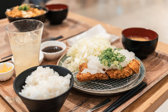 Deep-Fried Pork Cutlet Served With Rice and Fresh Salad in Restaurant