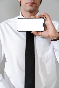 Business Professional Holding Smartphone with Blank Screen 