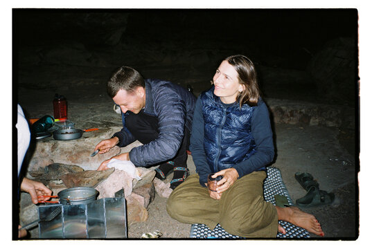 Hikers camping in a cave